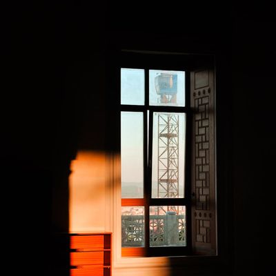 Sunlight streaming into a quiet empty room.